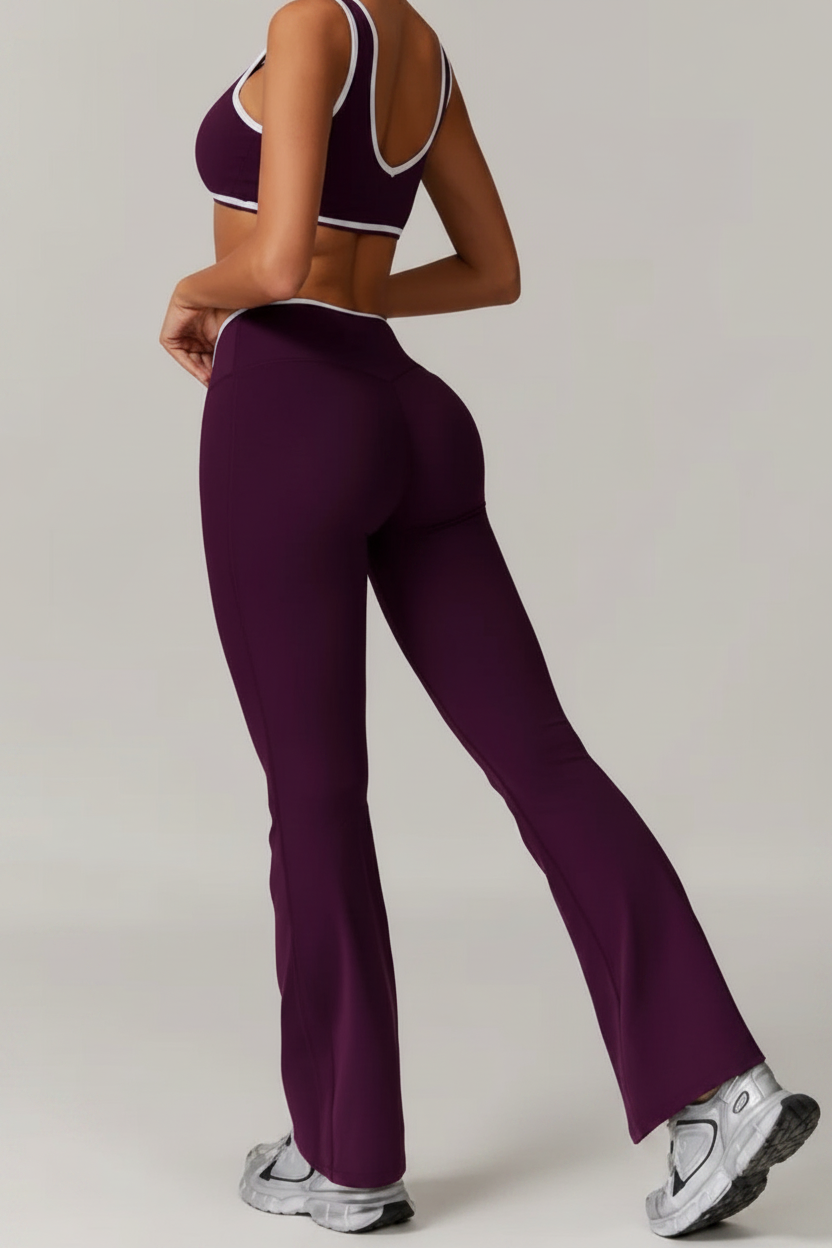 Person wearing a purple athletic outfit on a plain background