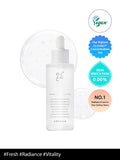 Skincare bottle with vegan and irritation-free labels on a white background