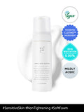 White skincare bottle with vegan and irritation-free labels on a white background