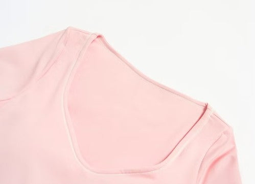 Close-up of a pink garment on a light gray background